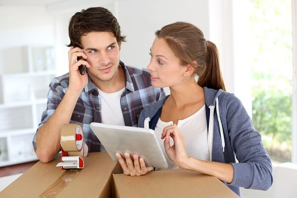 bigstock-Couple-calling-transport-compa-37113172 (1) Calling Movers
